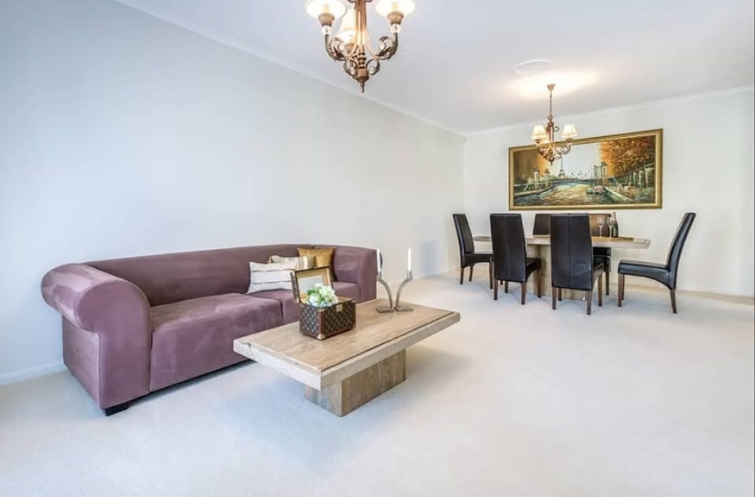 Living and dining room with freshly painted white walls